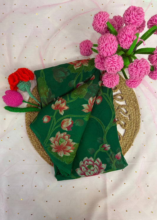 Green floral fabric with pink and red flowers on a white background