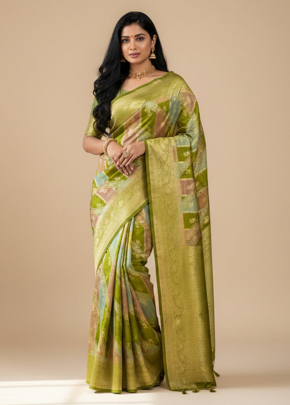 Woman in a green saree standing in front of corrugated metal panels.