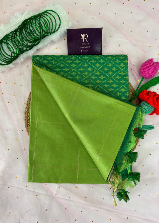 Green fabric with floral decorations on a white background