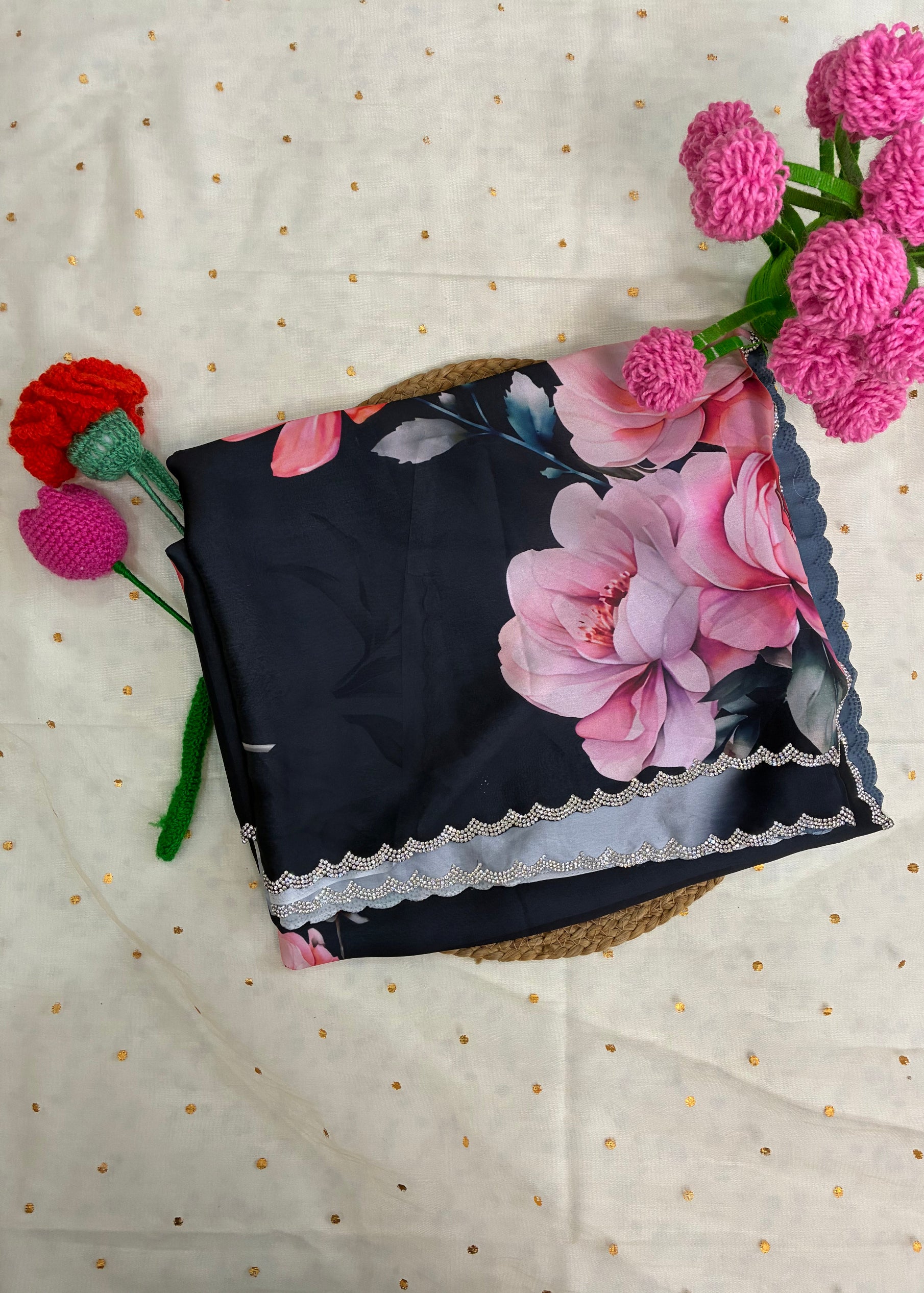Floral-patterned fabric with pink flowers on a textured white background